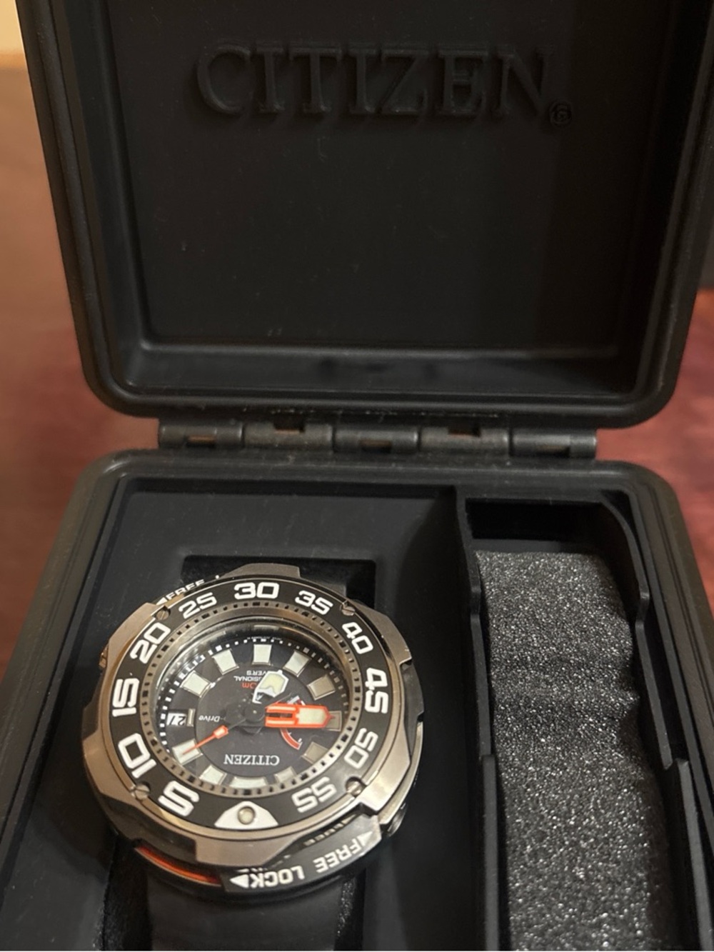 Citizen Black and Orange Dive Watch with Silver Bezel